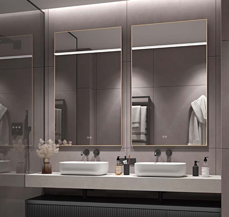 Gold framed bathroom mirrors with upper lighting in a contemporary double vanity setting